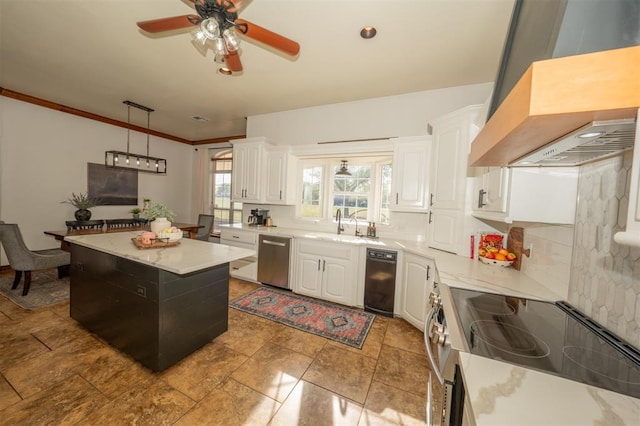 2400 Lost Lake Ln, Yukon, OK 73099 - kitchen featuring appliances with stainless steel finishes, wall chimney exhaust hood, white cabinets, light countertops, and ornamental molding