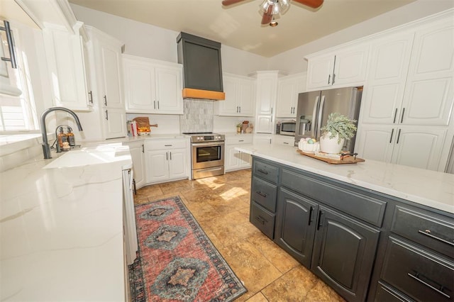 2400 Lost Lake Ln, Yukon, OK 73099 - kitchen with appliances with stainless steel finishes, white cabinets, a sink, and ceiling fan