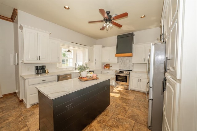 2400 Lost Lake Ln, Yukon, OK 73099 - kitchen with stainless steel appliances, decorative backsplash, ceiling fan, white cabinets, and recessed lighting