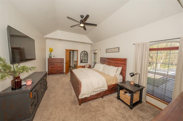2400 Lost Lake Ln, Yukon, OK 73099 - bedroom featuring light carpet, vaulted ceiling, and a ceiling fan