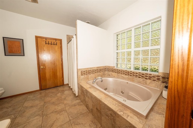 2400 Lost Lake Ln, Yukon, OK 73099 - bathroom with toilet, a jetted tub, and a shower with curtain