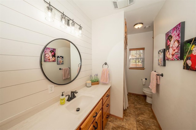 2400 Lost Lake Ln, Yukon, OK 73099 - full bathroom with vanity, toilet, and stone finish floors