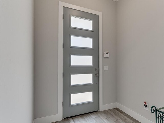 104 Rue De Montserrat, Norman, OK 73071 - doorway to outside with light wood finished floors and baseboards