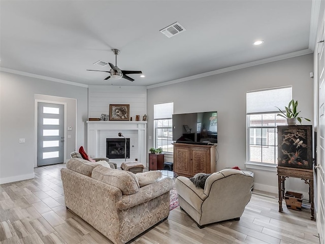104 Rue De Montserrat, Norman, OK 73071 - living area with a healthy amount of sunlight, baseboards, a ceiling fan, and visible vents