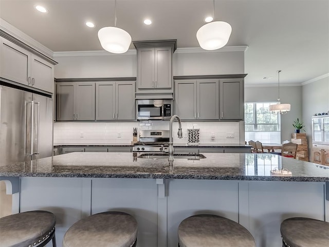 104 Rue De Montserrat, Norman, OK 73071 - kitchen with a sink, ornamental molding, appliances with stainless steel finishes, gray cabinetry, and decorative backsplash