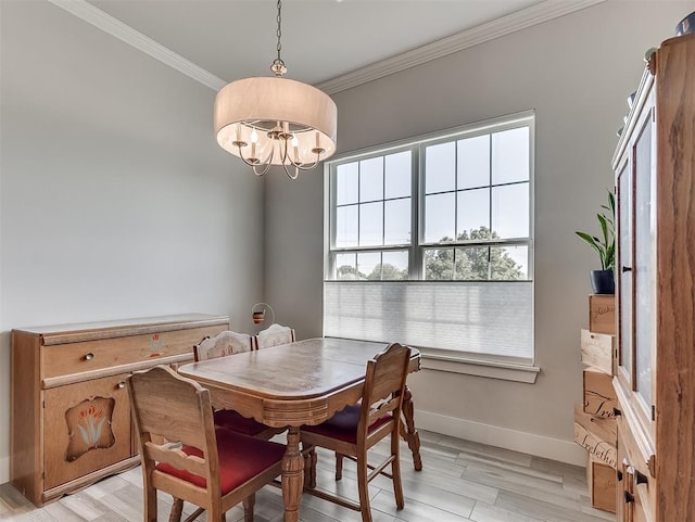 104 Rue De Montserrat, Norman, OK 73071 - dining space with crown molding, baseboards, light wood finished floors, and a chandelier