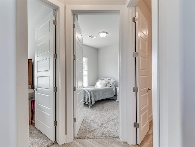 104 Rue De Montserrat, Norman, OK 73071 - corridor with visible vents and light wood-style flooring
