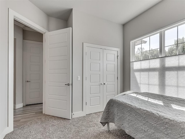 104 Rue De Montserrat, Norman, OK 73071 - bedroom with light wood-style flooring, a closet, and baseboards