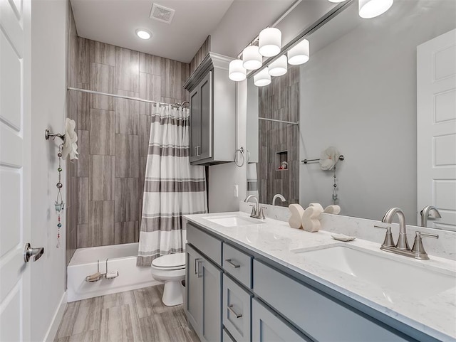 104 Rue De Montserrat, Norman, OK 73071 - full bathroom featuring a sink, visible vents, toilet, and shower / bath combo