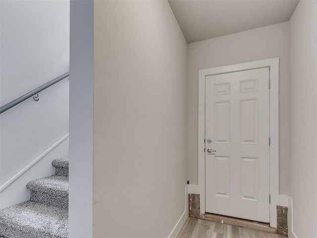 104 Rue De Montserrat, Norman, OK 73071 - doorway with stairway, light wood-type flooring, and baseboards
