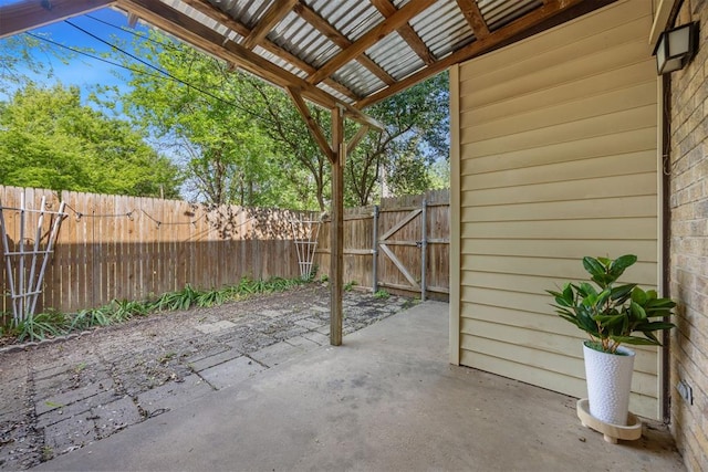 view of patio / terrace with fence and a gate