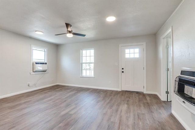 230 SE 50th St, Oklahoma City, OK 73129 - foyer featuring heating unit, cooling unit, wood finished floors, and a ceiling fan
