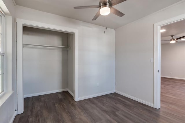 230 SE 50th St, Oklahoma City, OK 73129 - unfurnished bedroom with wood finished floors, a closet, and a ceiling fan