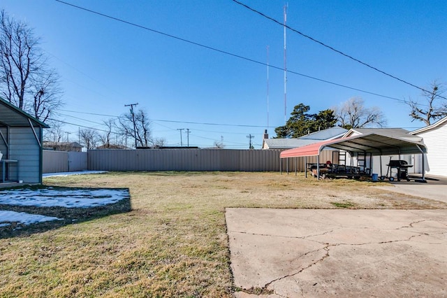 230 SE 50th St, Oklahoma City, OK 73129 - view of yard featuring a detached carport and driveway