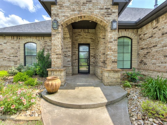 3108 Drake Crest Dr, Edmond, OK 73034 - doorway to property with roof with shingles and brick siding