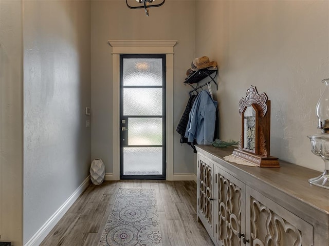 3108 Drake Crest Dr, Edmond, OK 73034 - doorway to outside featuring baseboards and wood finished floors