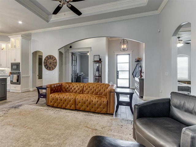 3108 Drake Crest Dr, Edmond, OK 73034 - living area featuring ceiling fan, ornamental molding, and arched walkways