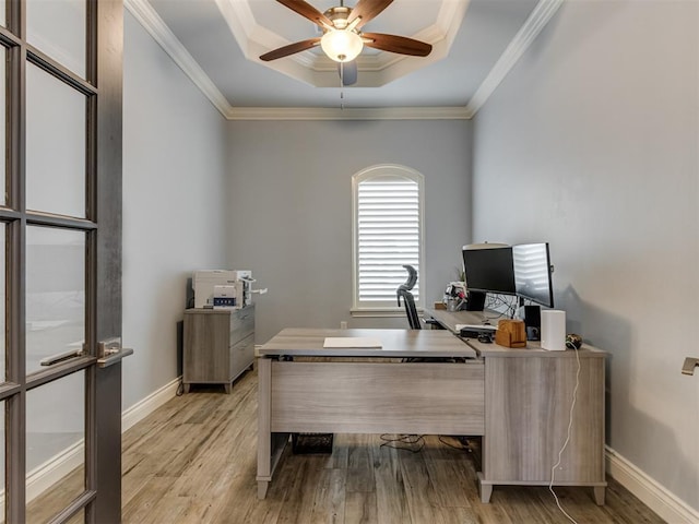 3108 Drake Crest Dr, Edmond, OK 73034 - home office with a raised ceiling, a ceiling fan, light wood finished floors, and baseboards