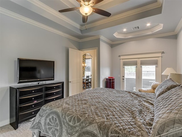 3108 Drake Crest Dr, Edmond, OK 73034 - bedroom with arched walkways, carpet floors, visible vents, crown molding, and a tray ceiling