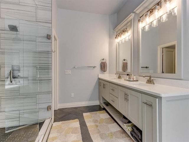 3108 Drake Crest Dr, Edmond, OK 73034 - full bathroom featuring baseboards, tiled shower, double vanity, and a sink