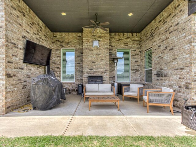 3108 Drake Crest Dr, Edmond, OK 73034 - view of patio / terrace featuring grilling area, an outdoor living space with a fireplace, and a ceiling fan