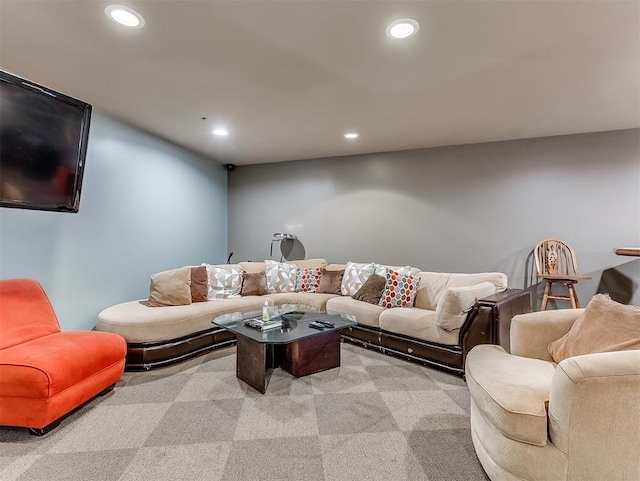 living room with light carpet and recessed lighting