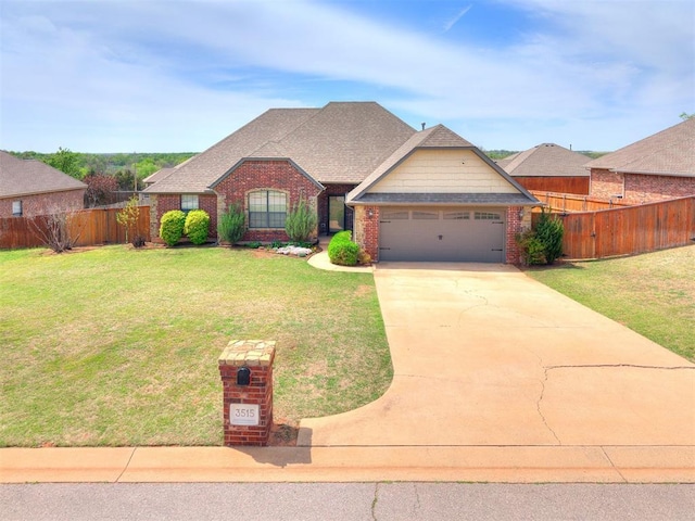 3515 Homesteaders Ln, Guthrie, OK 73044 - view of front of property with a front lawn, driveway, an attached garage, fence, and brick siding