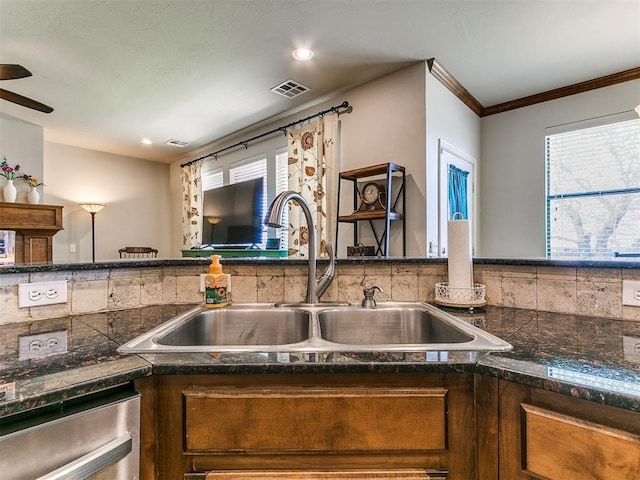 3515 Homesteaders Ln, Guthrie, OK 73044 - kitchen featuring dishwasher, crown molding, a sink, and visible vents