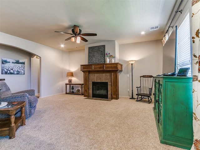 3515 Homesteaders Ln, Guthrie, OK 73044 - living area with arched walkways, visible vents, carpet flooring, and ceiling fan