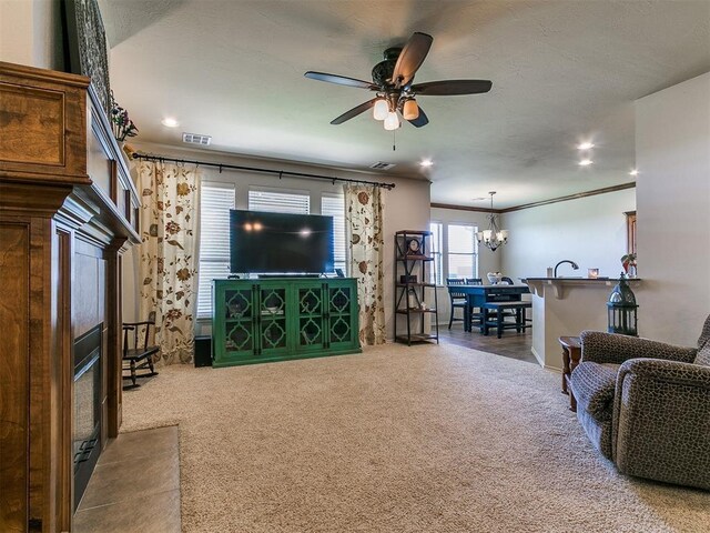 3515 Homesteaders Ln, Guthrie, OK 73044 - living area with recessed lighting, carpet, visible vents, and ceiling fan with notable chandelier