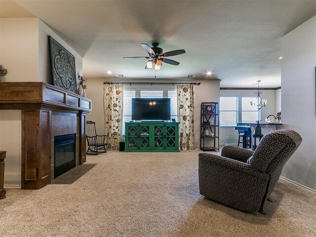 3515 Homesteaders Ln, Guthrie, OK 73044 - living room with recessed lighting, carpet floors, ceiling fan with notable chandelier, and a tiled fireplace