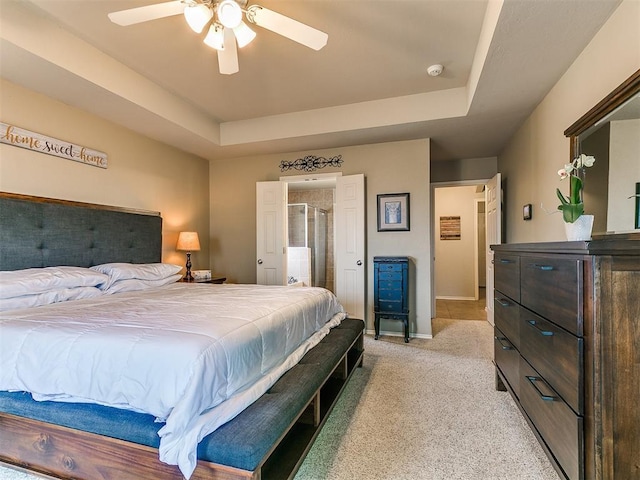 3515 Homesteaders Ln, Guthrie, OK 73044 - bedroom featuring a ceiling fan, baseboards, a raised ceiling, and light colored carpet