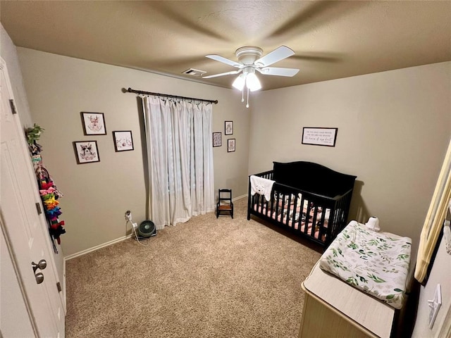 3515 Homesteaders Ln, Guthrie, OK 73044 - carpeted bedroom with baseboards, a ceiling fan, and visible vents