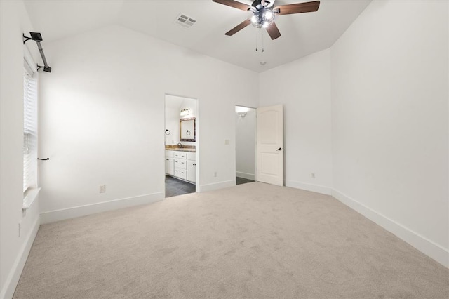 unfurnished bedroom with carpet floors, visible vents, baseboards, and a sink