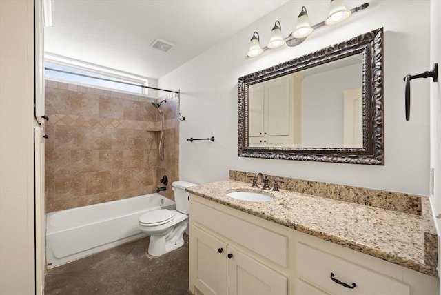 bathroom with visible vents, toilet, vanity, and shower / washtub combination