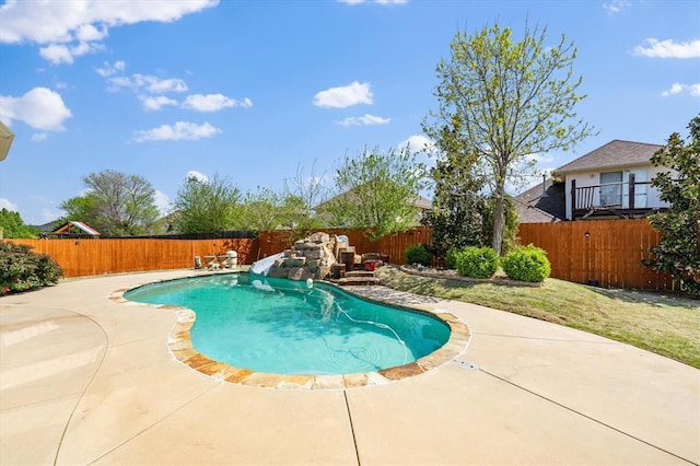 view of swimming pool with a fenced backyard, a patio, and a fenced in pool