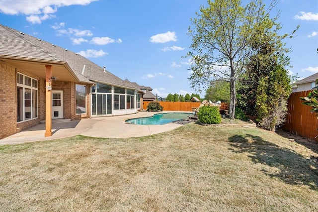 view of pool featuring a fenced backyard, a yard, and a patio