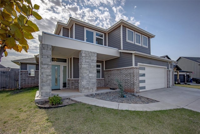 view of front of home with driveway, an attached garage, fence, a front yard, and brick siding