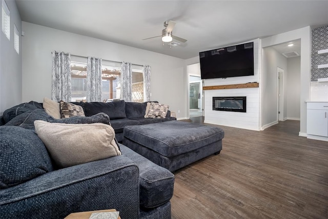 6116 Dale Ave, Edmond, OK 73034 - living room featuring ceiling fan, wood finished floors, and a fireplace