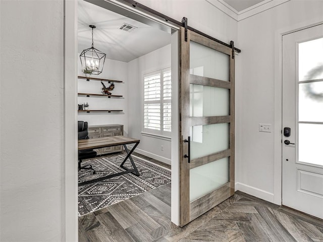 interior space featuring a barn door, visible vents, and a notable chandelier