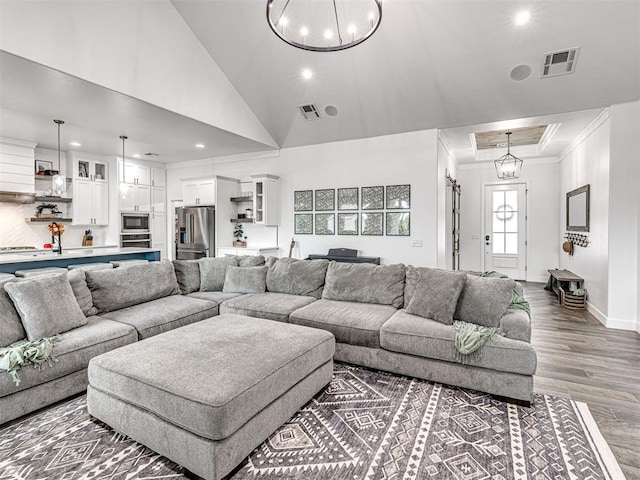 living room featuring ornamental molding, recessed lighting, visible vents, and dark wood finished floors