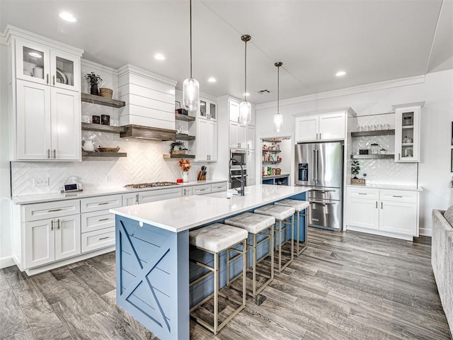 kitchen with stainless steel appliances, open shelves, tasteful backsplash, white cabinetry, and light countertops