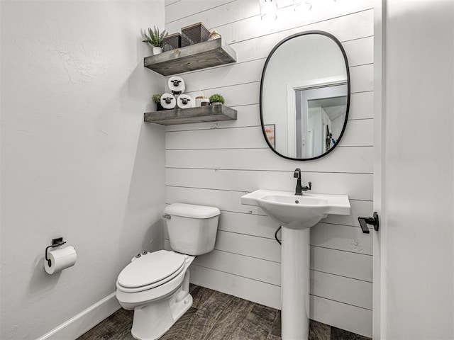 bathroom with wood finished floors and toilet