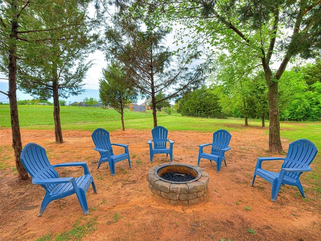 view of yard with a fire pit
