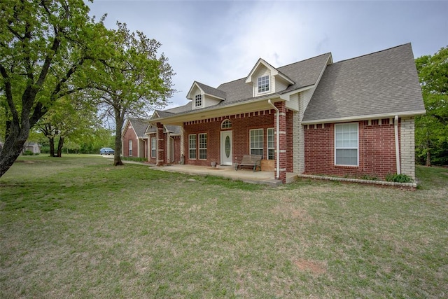 2400 Whiteoak Dr, Blanchard, OK 73010 - rear view of property featuring brick siding, a yard, a patio area, and roof with shingles