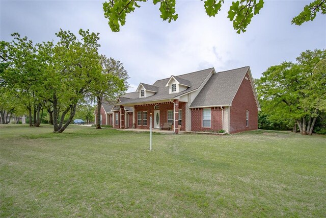2400 Whiteoak Dr, Blanchard, OK 73010 - new england style home featuring brick siding and a front yard