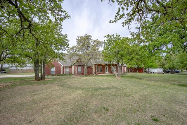 2400 Whiteoak Dr, Blanchard, OK 73010 - ranch-style house with brick siding and a front yard