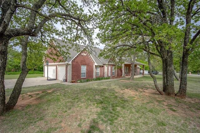 2400 Whiteoak Dr, Blanchard, OK 73010 - single story home featuring driveway, a shingled roof, an attached garage, a front yard, and brick siding