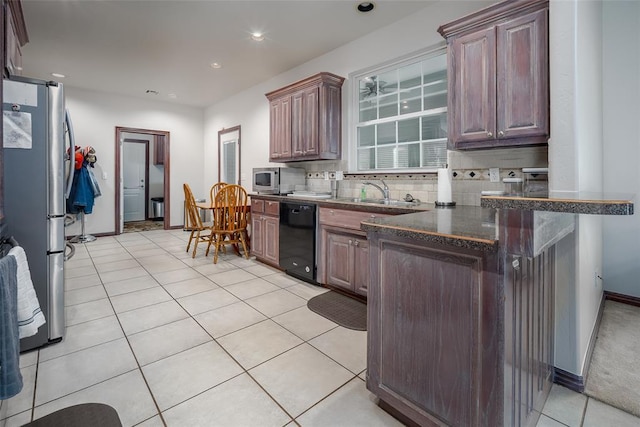 2400 Whiteoak Dr, Blanchard, OK 73010 - kitchen with a sink, tasteful backsplash, recessed lighting, appliances with stainless steel finishes, and light tile patterned floors