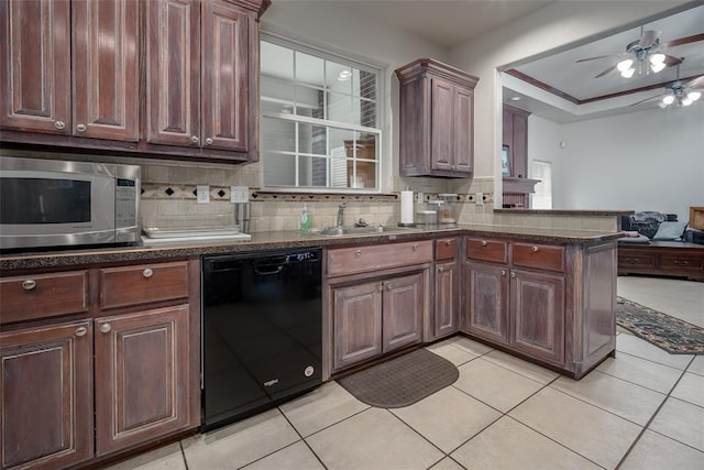 2400 Whiteoak Dr, Blanchard, OK 73010 - kitchen with tasteful backsplash, a sink, dishwasher, ceiling fan, and stainless steel microwave